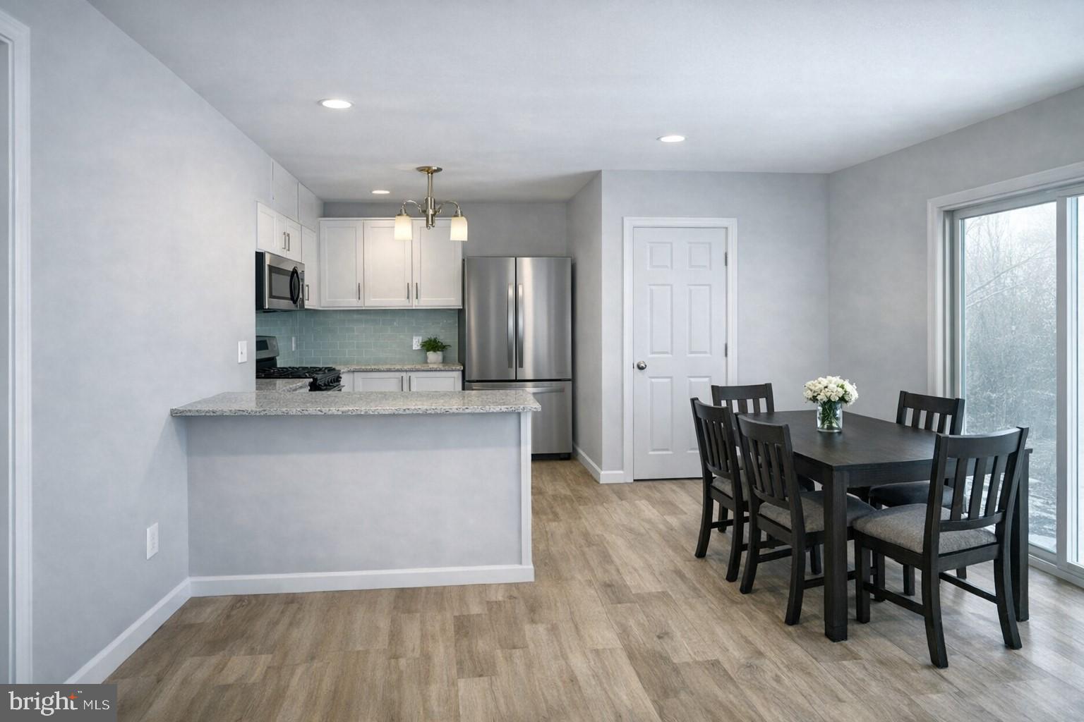 411 Clover Court Taneytown, MD 21787 - Photo 7 of 17 a kitchen with kitchen island wooden cabinets and counter space