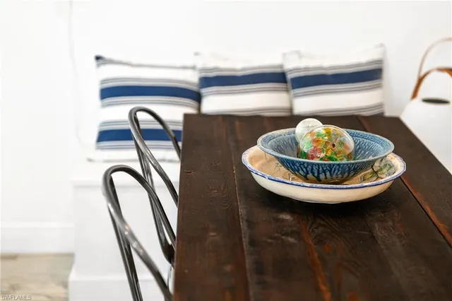 a dining room with a table and chairs