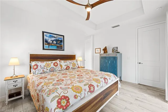 a view of a room that has a bed and a window