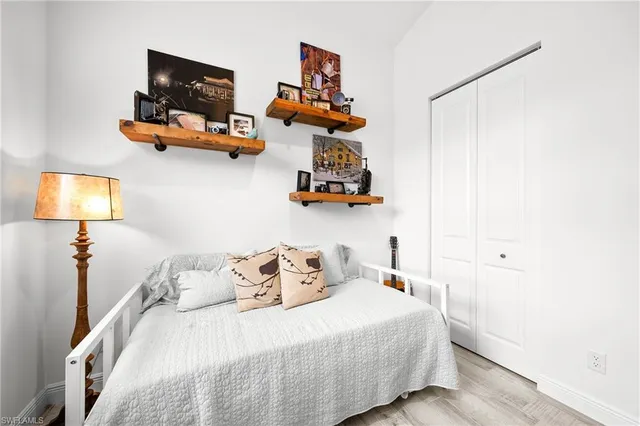 a bedroom with bed and window