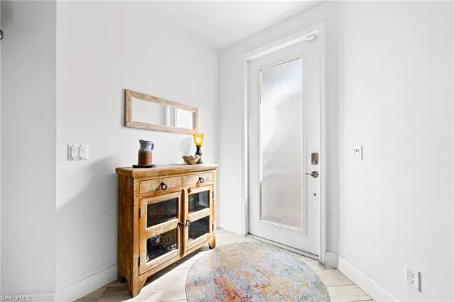 a bedroom with bed and window