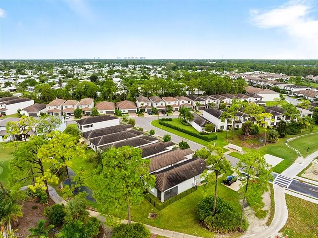 an aerial view of a golf course with parking space
