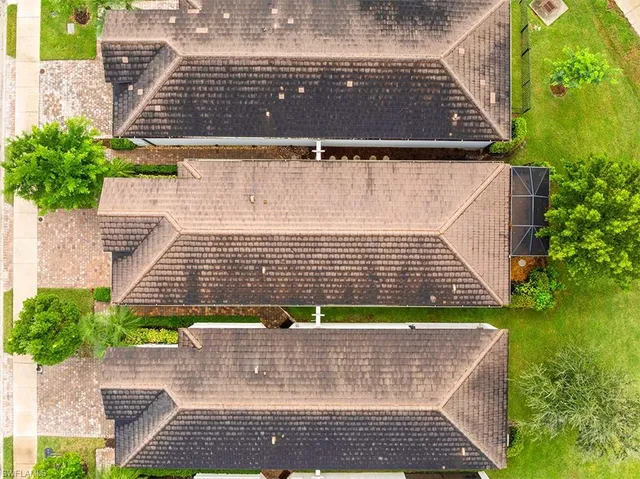 an aerial view of a house with a garden