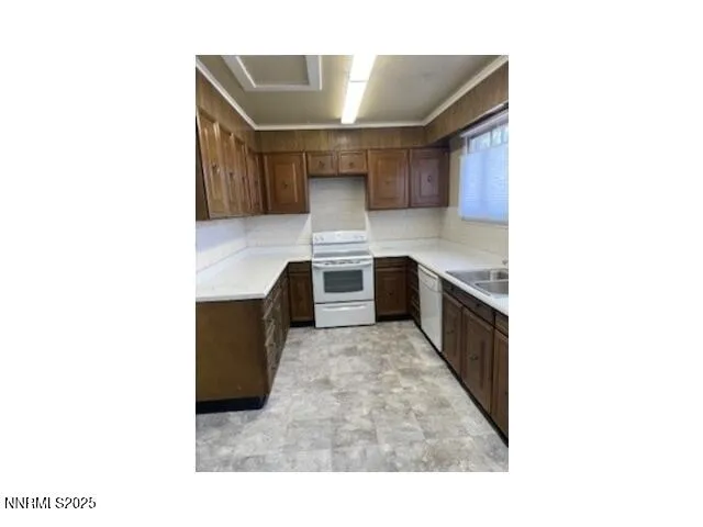 a kitchen with kitchen island cabinets and oven