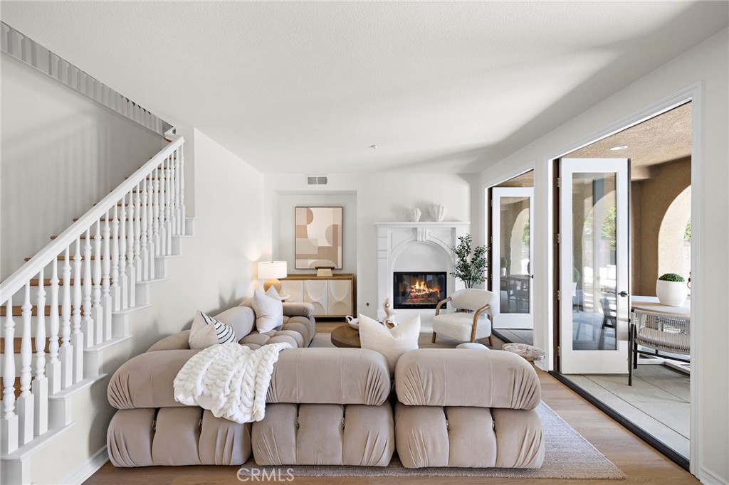 47 Tuscany Ladera Ranch, CA 92694 - Photo 4 of 28 a living room with furniture and a fireplace