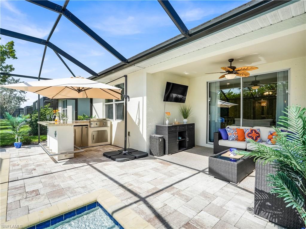 14695 Edgewater Circle Naples, FL 34114 - Photo 25 of 39 a view of a chairs and tables in the patio