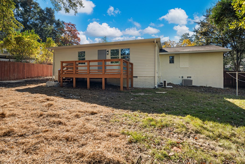 4903 Chapman Street Columbus, GA 31907 - Photo 14 of 14 a backyard of a house with table and chairs