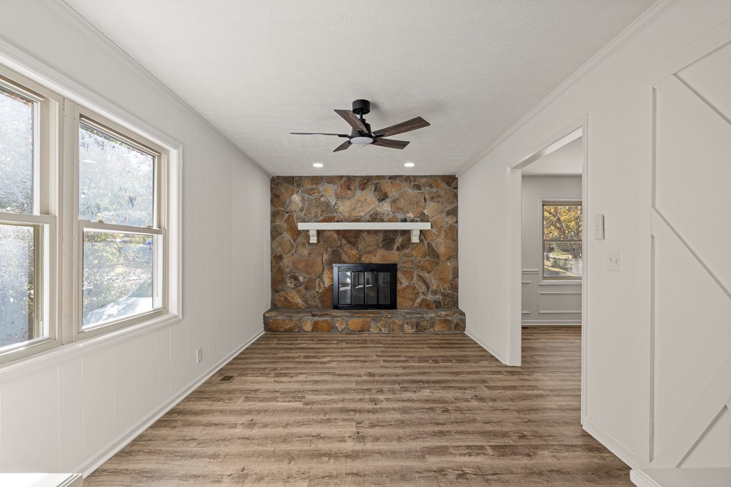 4903 Chapman Street Columbus, GA 31907 - Photo 5 of 14 a view of a livingroom with a fireplace and window