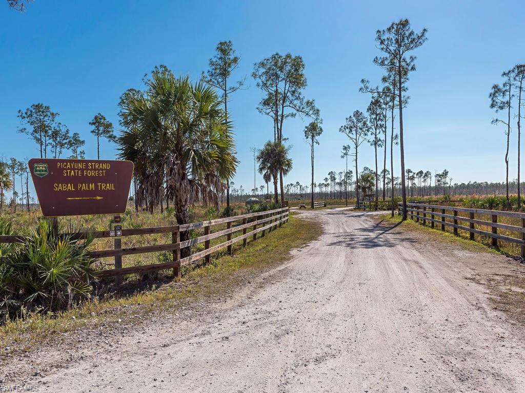 7650 Irgang Road Naples, FL 34114 - Photo 7 of 11 a view of a park with large trees