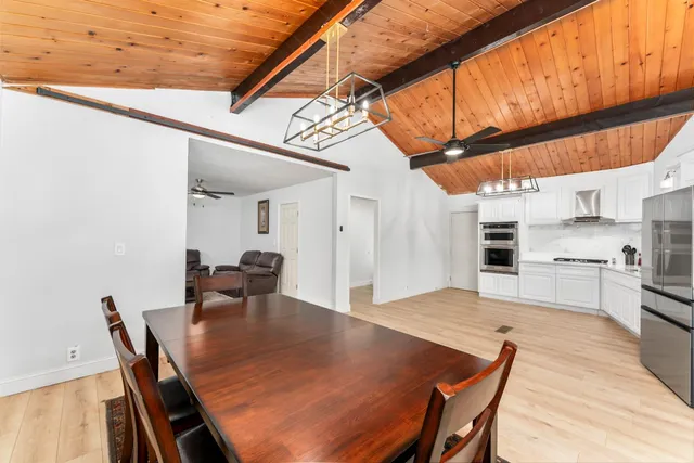 a kitchen with a table and chairs in it