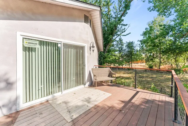 a view of a backyard with wooden fence
