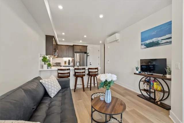 a kitchen with kitchen island a sink stainless steel appliances and cabinets