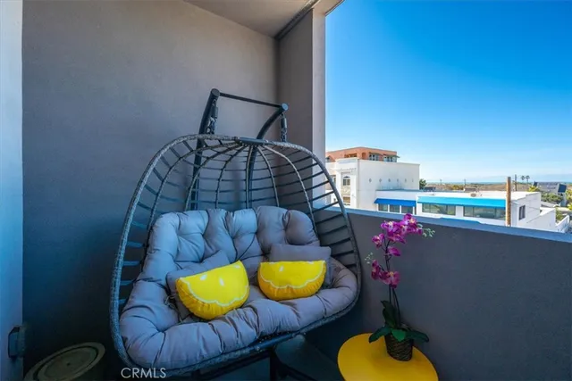 a view of a swimming pool with outdoor seating