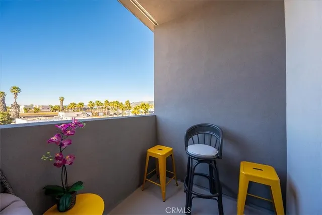 a view of a balcony with lake view and wooden floor