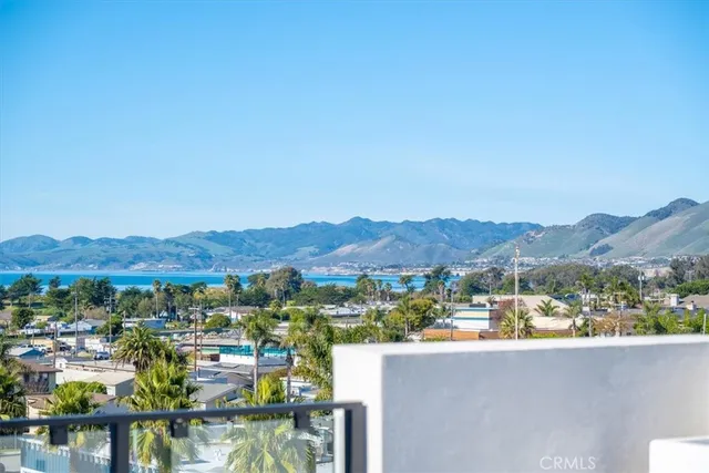 a view of a house with a backyard porch and sitting area