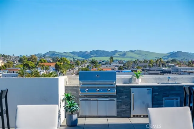 a view of a terrace with couches and potted plants