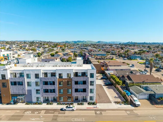 an aerial view of residential building and ocean