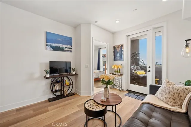 a kitchen with refrigerator and chairs