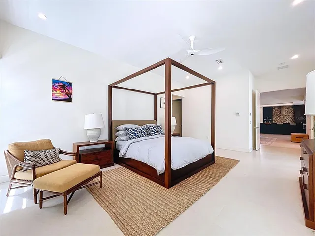 a bedroom with furniture and a window