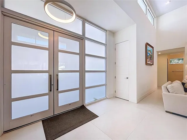 a living room with furniture rug and window