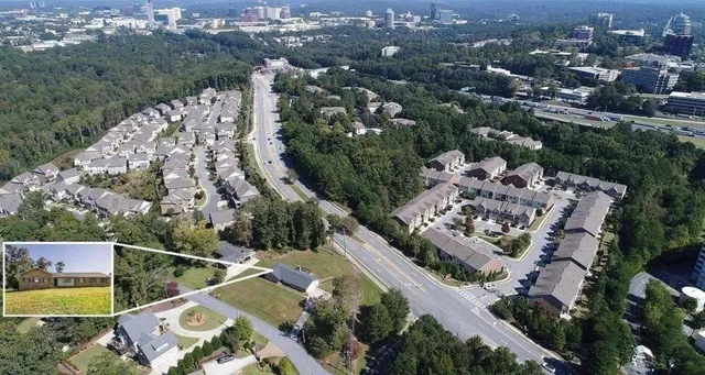an aerial view of a house with a yard