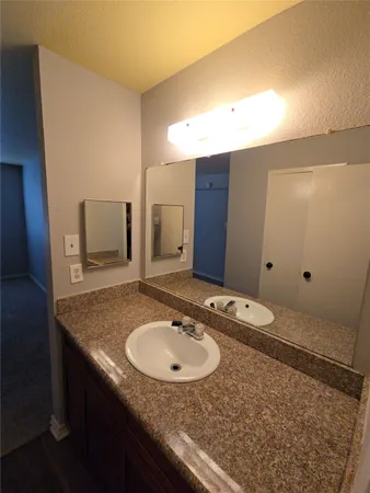 a kitchen with a stove and a microwave