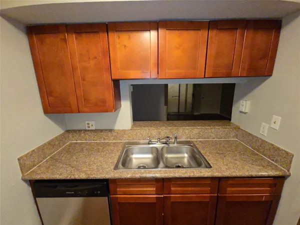 a kitchen with a sink and a stove
