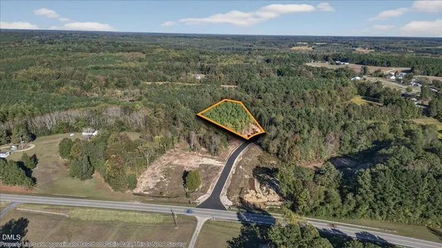 an aerial view of houses with yard