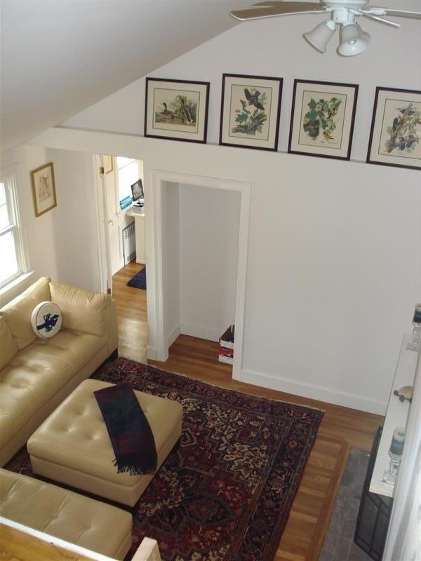 60 Elliott Road Centerville, MA 02632 - Photo 2 of 22 a living room with a couch and painting on the wall