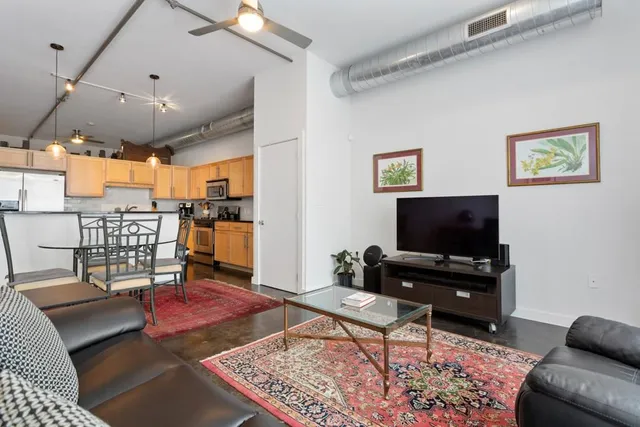 a living room with furniture and a flat screen tv