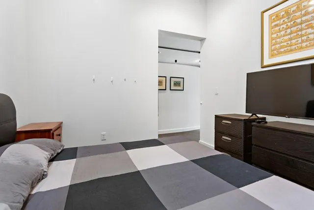 a bedroom with a bed and furniture