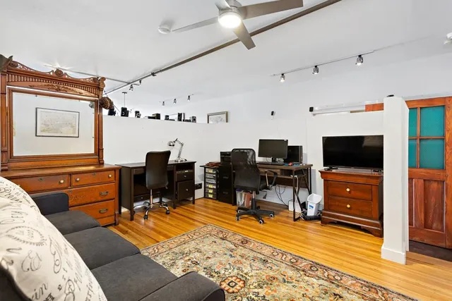 a room with furniture and a flat screen tv