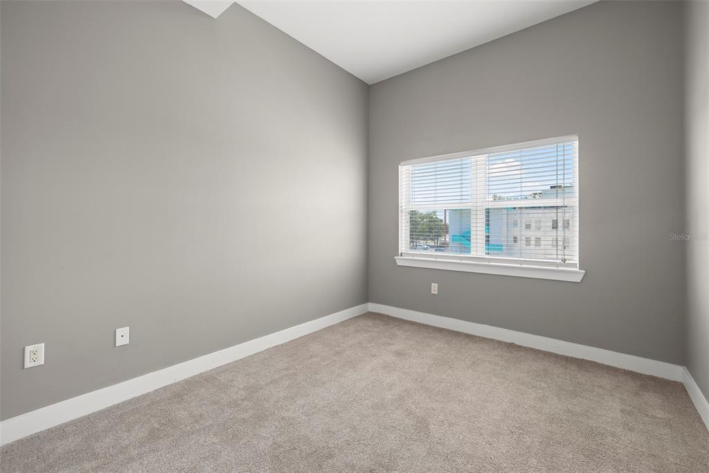 1010 Central Avenue, Unit 302 St. Petersburg, FL 33705 - Photo 15 of 50 an empty room with windows