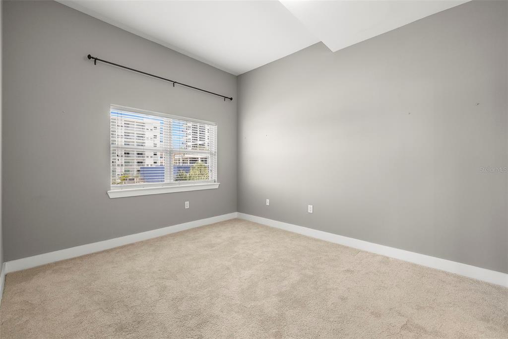 1010 Central Avenue, Unit 302 St. Petersburg, FL 33705 - Photo 19 of 50 an empty room with windows