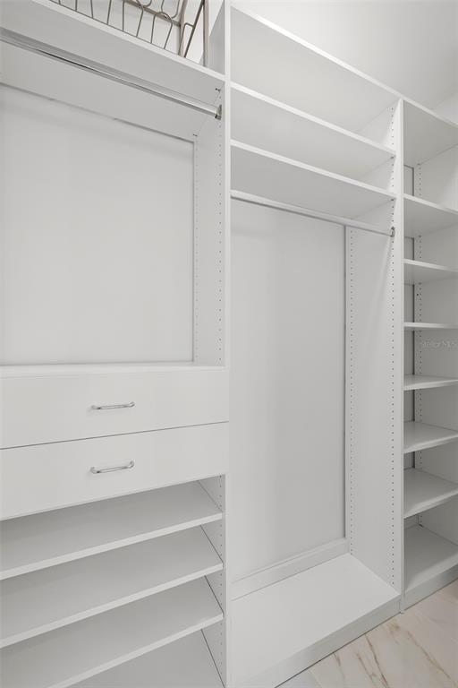 1010 Central Avenue, Unit 302 St. Petersburg, FL 33705 - Photo 24 of 50 a view of walk in closet with empty racks