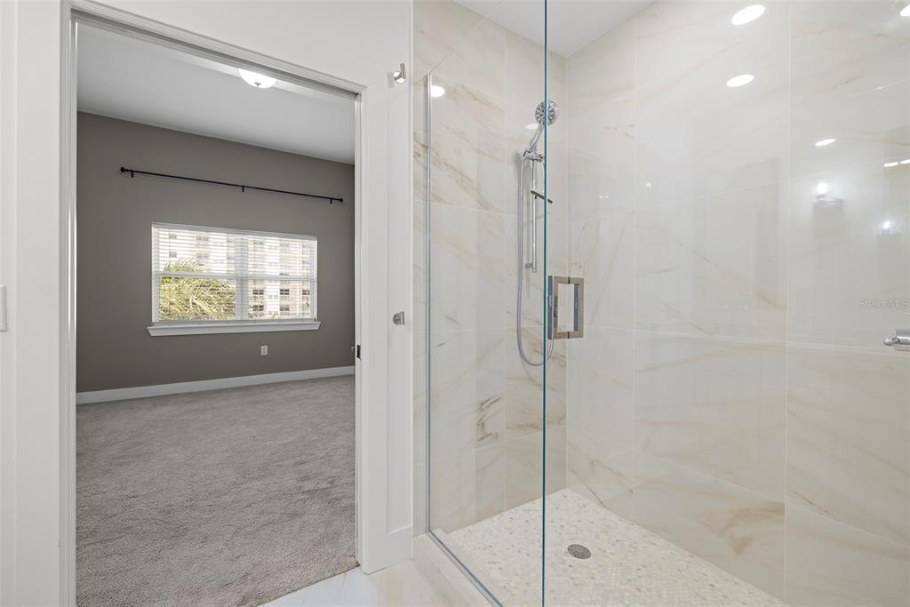 1010 Central Avenue, Unit 302 St. Petersburg, FL 33705 - Photo 25 of 50 a bathroom with a shower and a sink