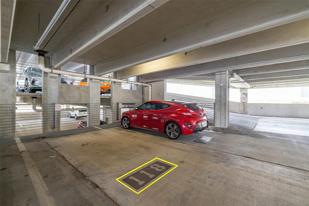 1010 Central Avenue, Unit 302 St. Petersburg, FL 33705 - Photo 34 of 50 a view of parking garage with cars parked