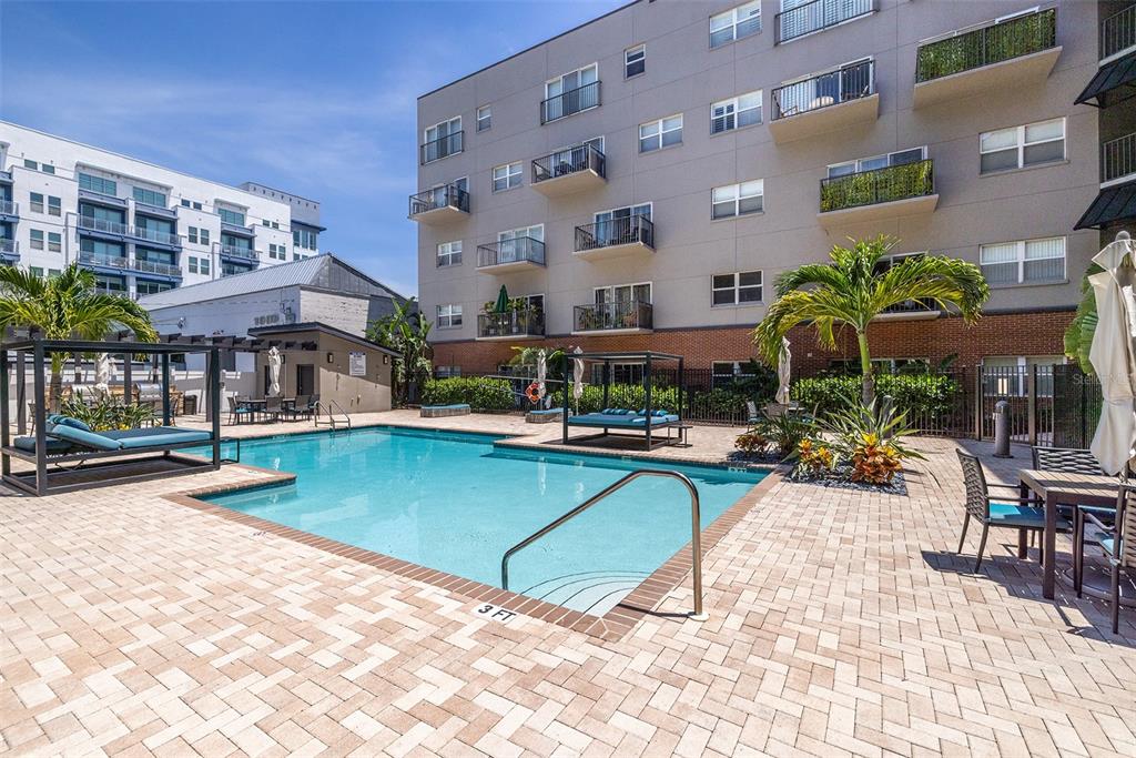 1010 Central Avenue, Unit 302 St. Petersburg, FL 33705 - Photo 39 of 50 a view of pool with outdoor seating