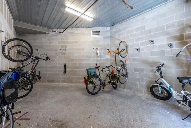 a living room with lots of furniture and a large window