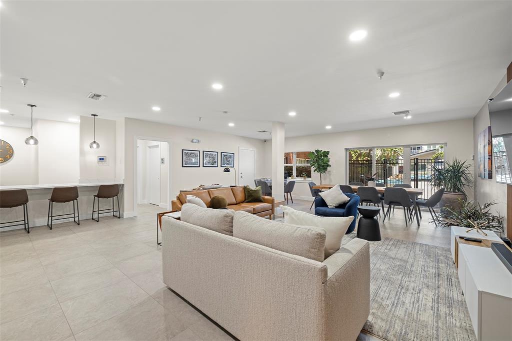 1010 Central Avenue, Unit 302 St. Petersburg, FL 33705 - Photo 44 of 50 a living room with lots of furniture and a large window