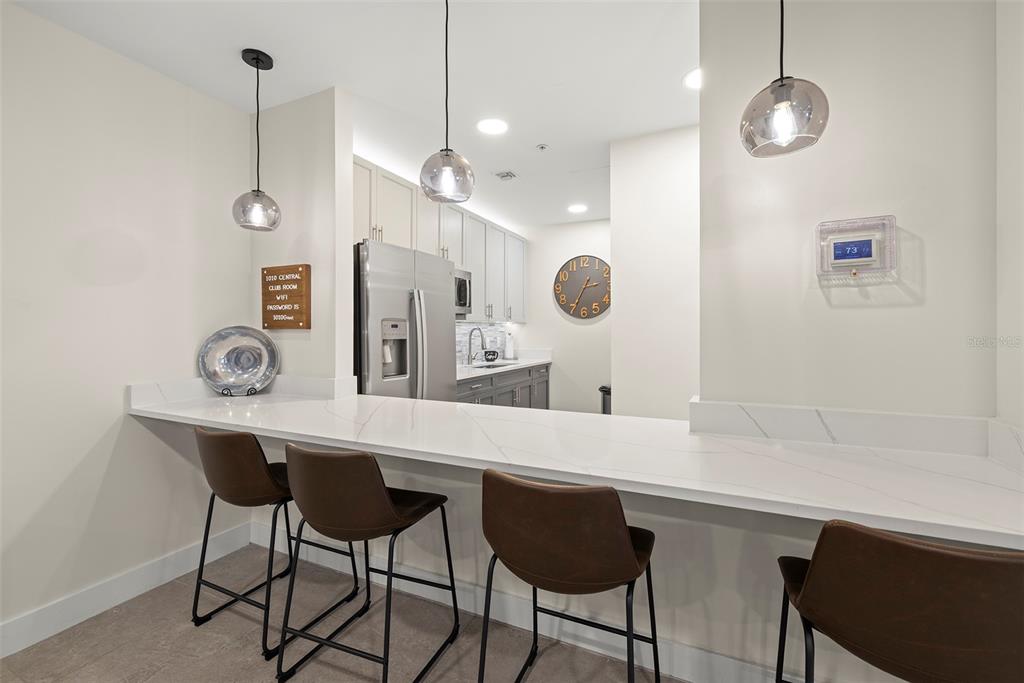 1010 Central Avenue, Unit 302 St. Petersburg, FL 33705 - Photo 46 of 50 a kitchen with a table and chairs in it