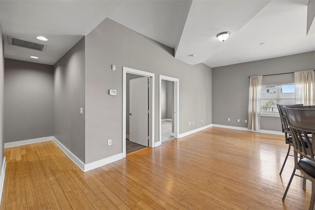1010 Central Avenue, Unit 302 St. Petersburg, FL 33705 - Photo 5 of 50 a view of a livingroom with a furniture and wooden floor