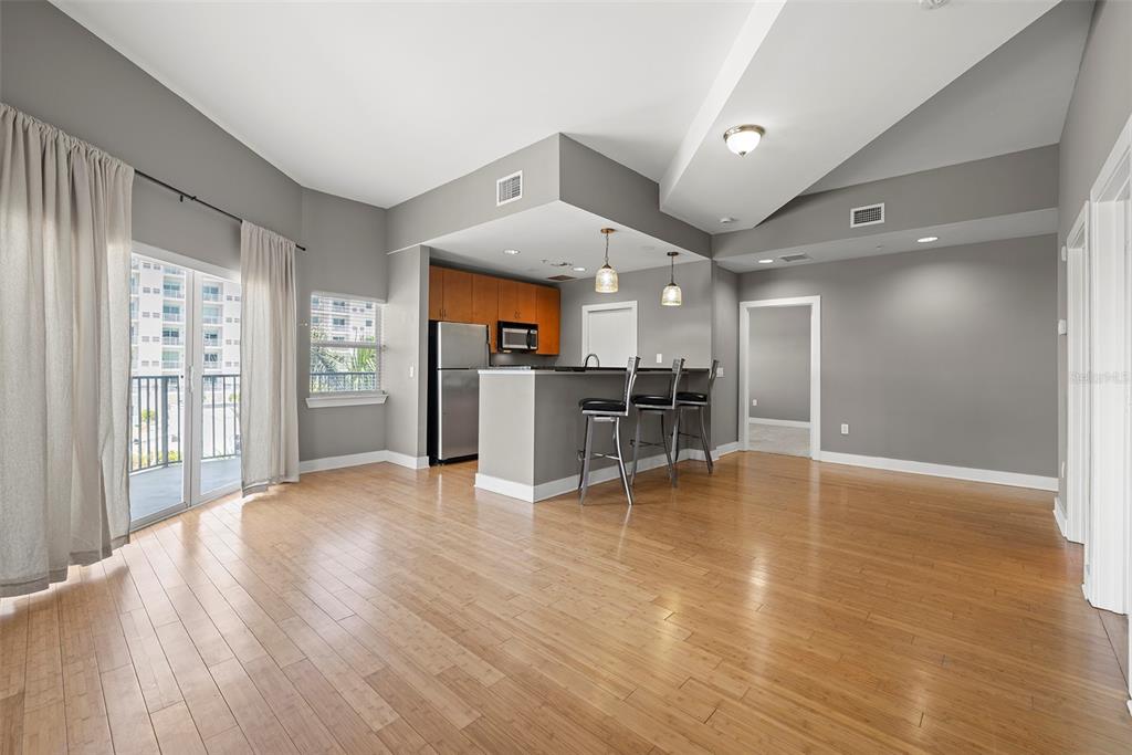 1010 Central Avenue, Unit 302 St. Petersburg, FL 33705 - Photo 7 of 50 a view of a kitchen with a sink and a refrigerator