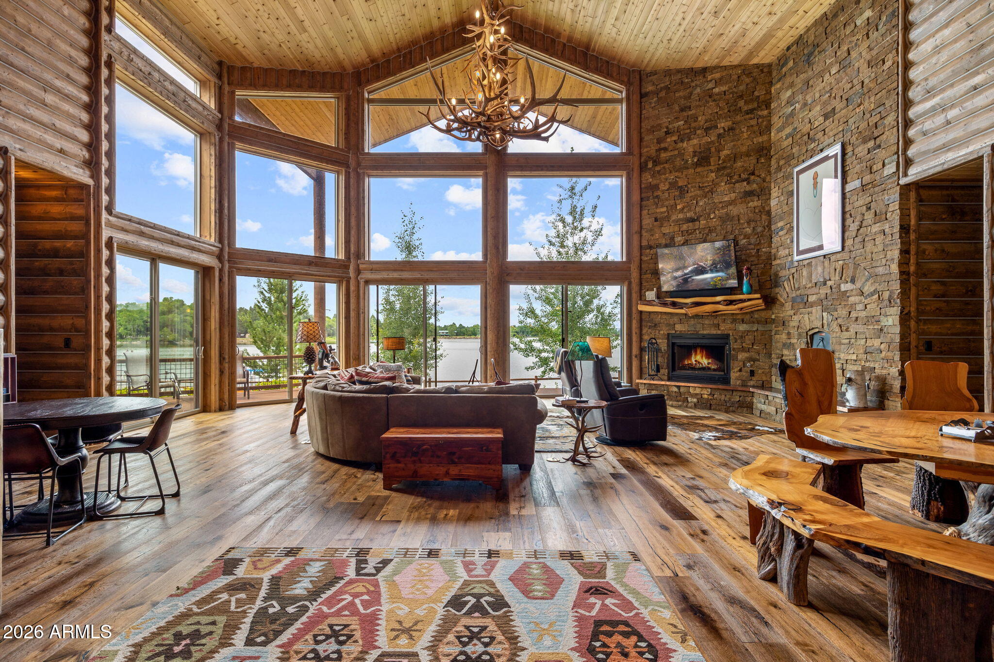 758 Southlake Road Lakeside, AZ 85929 - Photo 4 of 95 a living room with furniture large windows and wooden floor