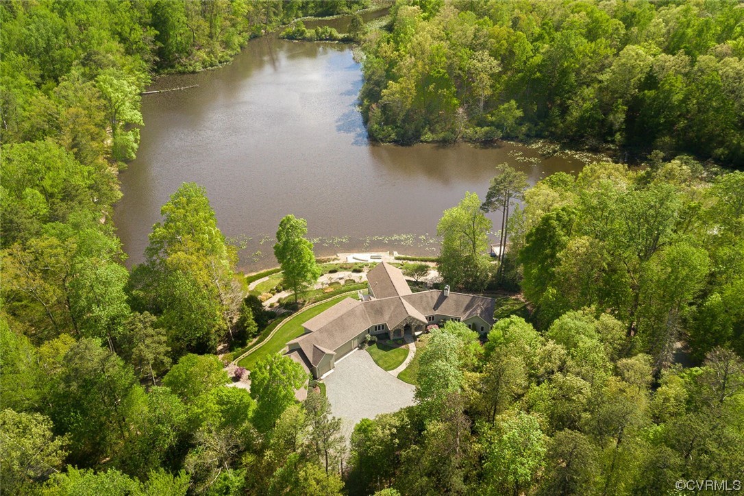 3535 Meadow Road Sandston, VA 23150 - Photo 2 of 50 an aerial view of a house with a yard and lake view