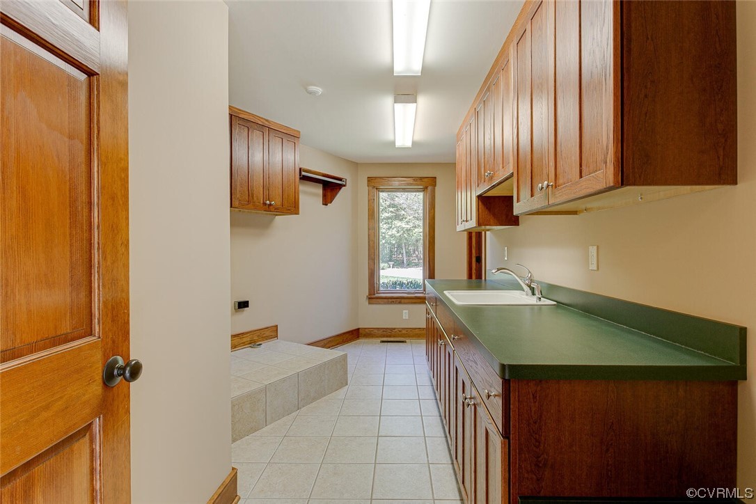 3535 Meadow Road Sandston, VA 23150 - Photo 24 of 50 a bathroom with a sink and a mirror