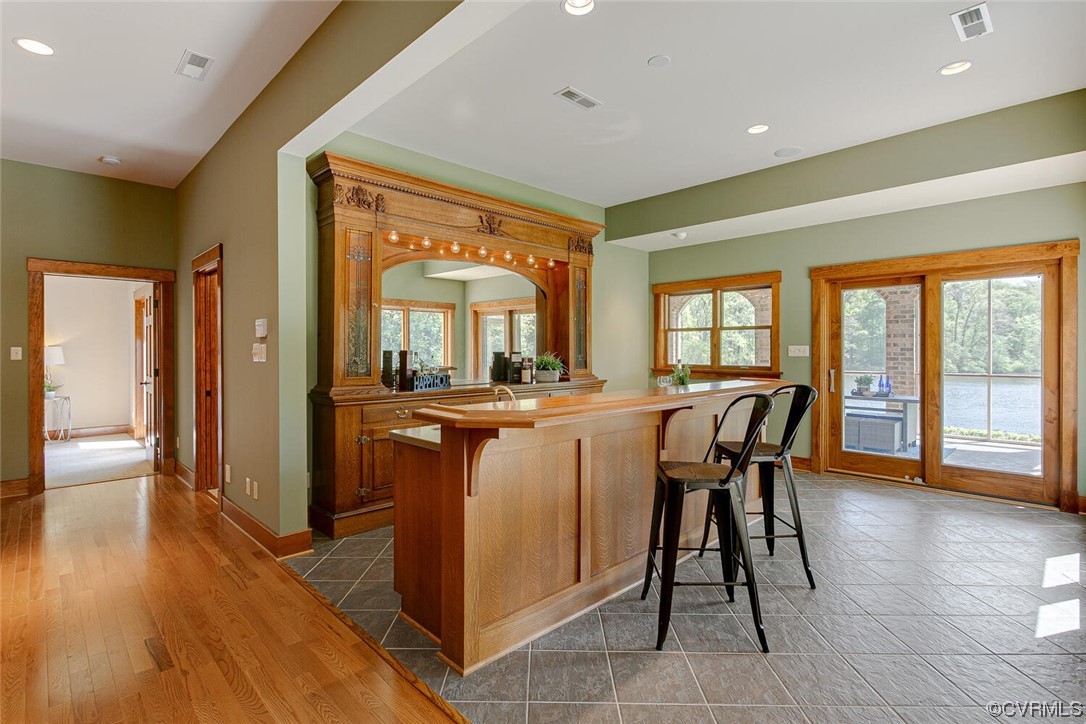 3535 Meadow Road Sandston, VA 23150 - Photo 33 of 50 a dining room with stainless steel appliances granite countertop a sink a table and chairs
