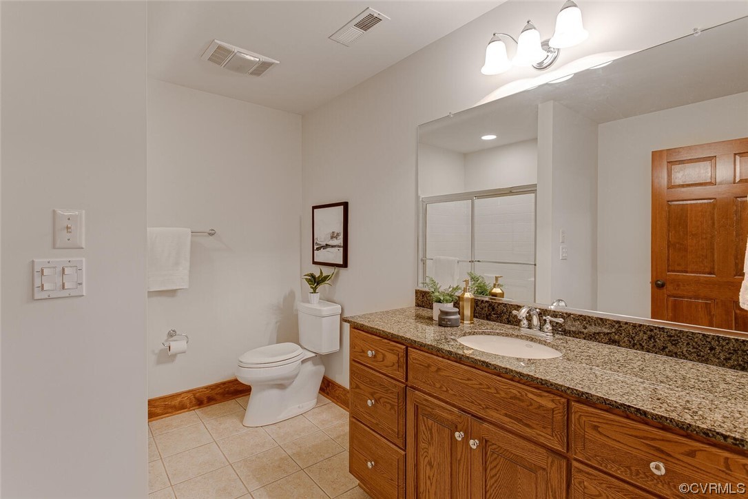 3535 Meadow Road Sandston, VA 23150 - Photo 37 of 50 a bathroom with a double vanity sink and a toilet