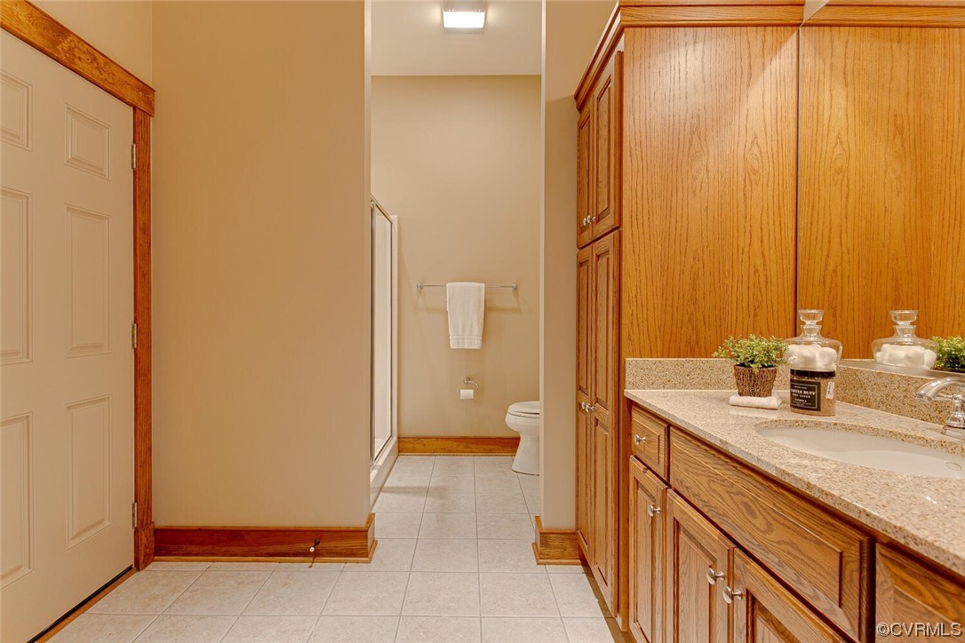 3535 Meadow Road Sandston, VA 23150 - Photo 40 of 50 a bathroom with a granite countertop sink and a mirror