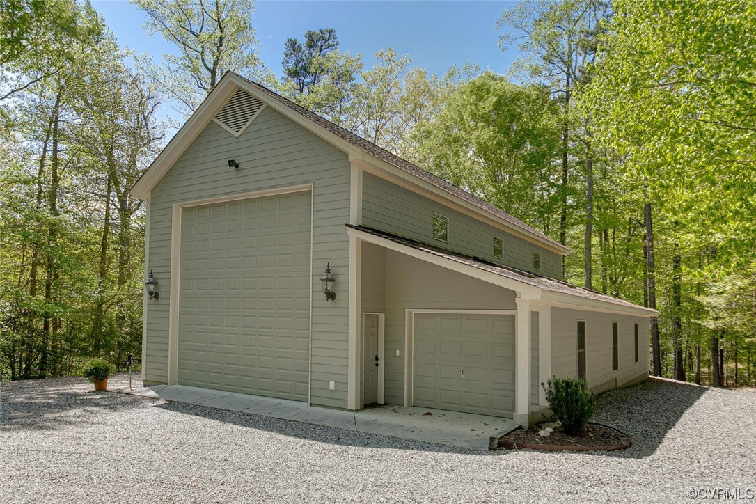 3535 Meadow Road Sandston, VA 23150 - Photo 45 of 50 a front view of a house with garden